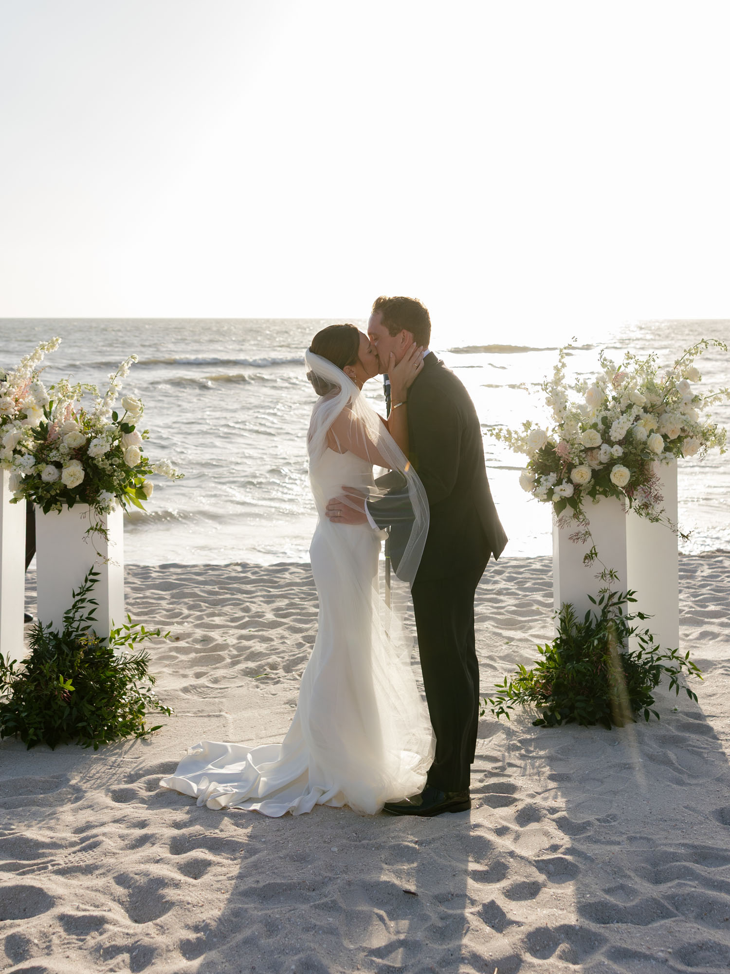 Outdoor ceremony setup for a Ritz Carlton Naples wedding with white florals by Veronica Costa Photography