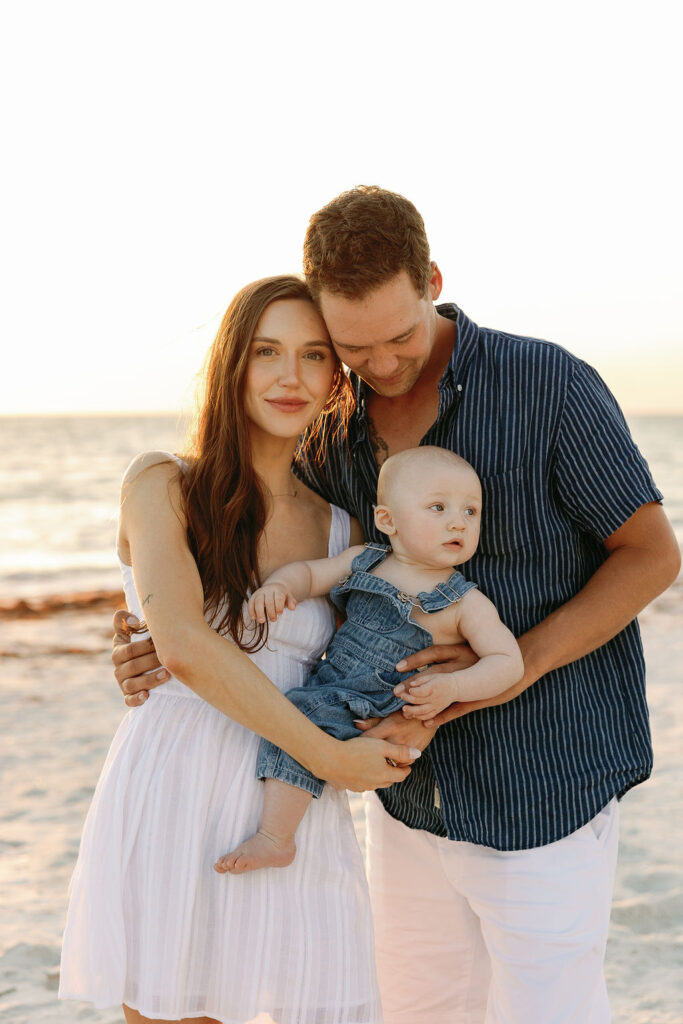 Natural portrait session with family of 3 with ideas for what to wear for family beach photos