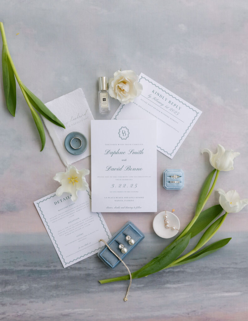 Wedding invitations styled flat lay at Naples LaPlaya Beach Resort wedding by Veronica Costa Photography