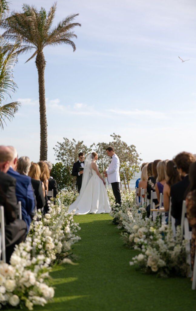 Outdoor ceremony on the Gulf Lawn at LaPlaya Beach & Golf Resort wedding by Veronica Costa Photography