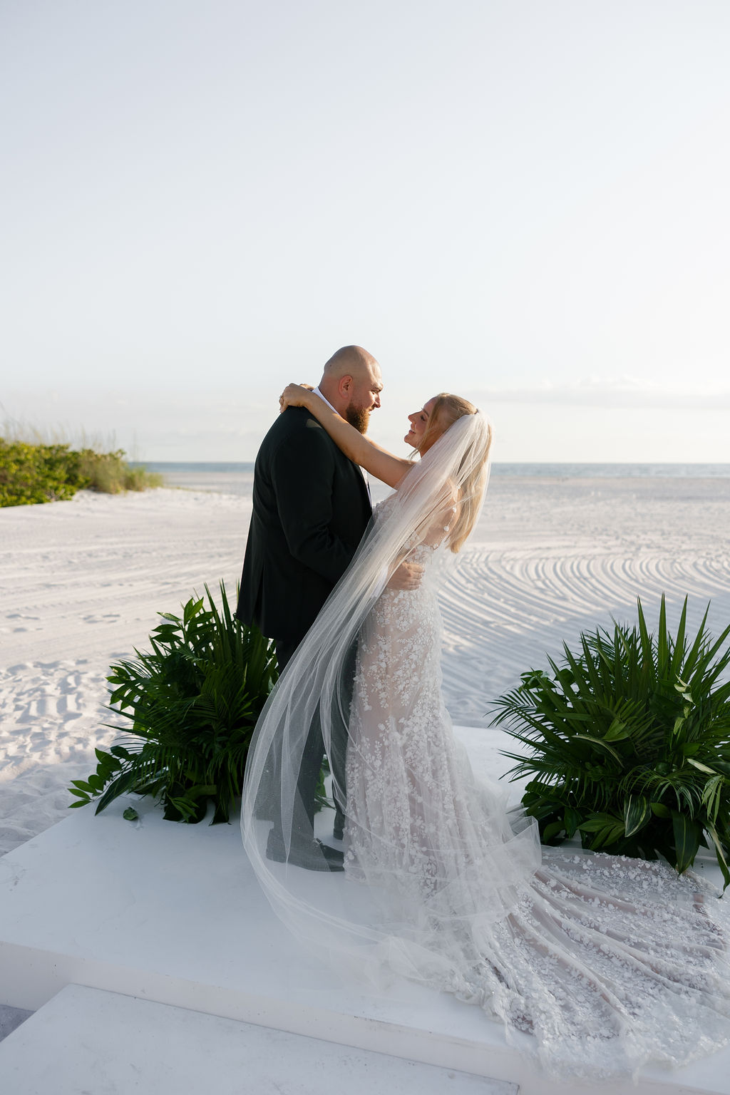 Beachfront bride and groom portraits at one of the most beautiful wedding venues in Naples Florida, JW Marriott Marco Island