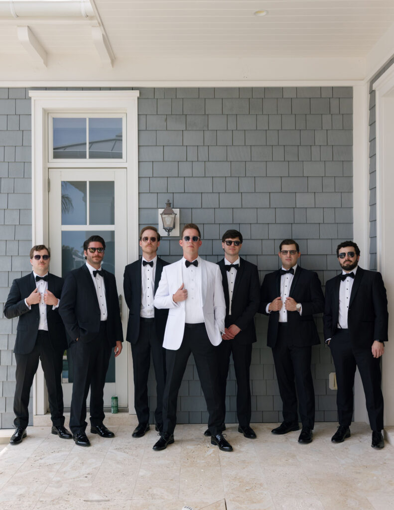 Groomsmen posing before ceremony at Naples LaPlaya Beach & Golf Resort by Veronica Costa Photography