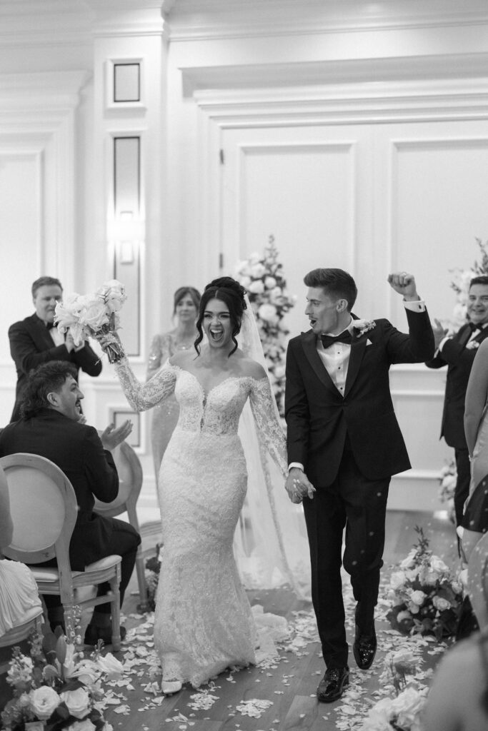 Cheering after wedding ceremony at The Club at the Strand wedding by Veronica Costa Photography