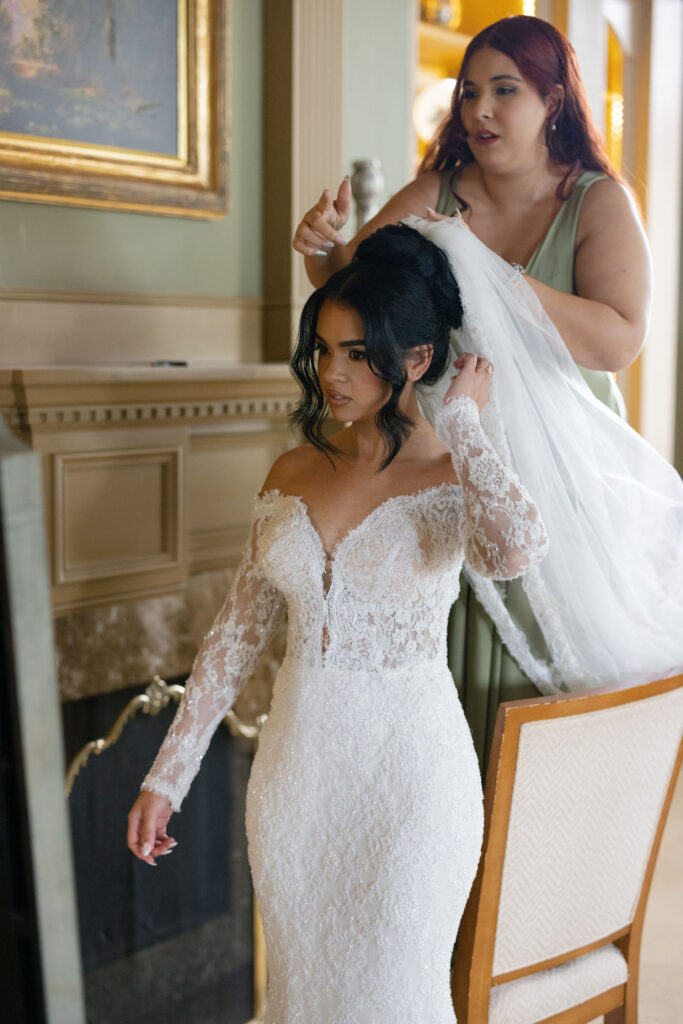 Bride getting ready in her suite before The Club at the Strand wedding by Veronica Costa Photography